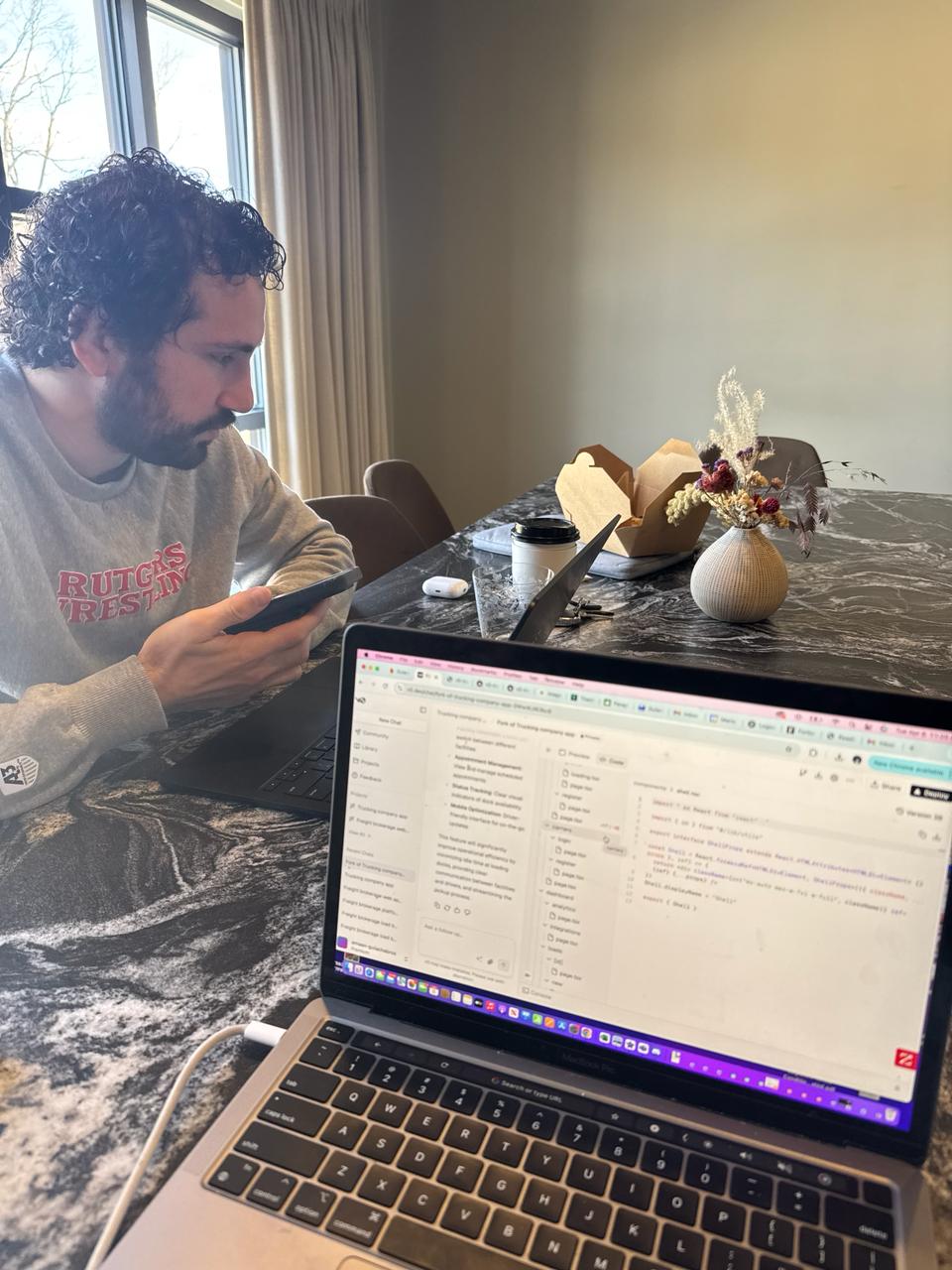 Malik Amine, tech entrepreneur turned financial advisor, coding at his desk